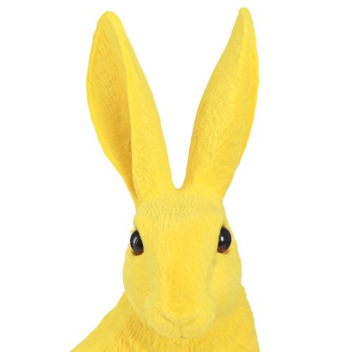 Artículo Conejito decorativo sentado Conejito de Pascua flocado amarillo 12×9×25cm