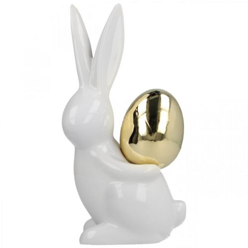 Artículo Conejitos de Pascua elegantes, conejitos de cerámica con huevo dorado, decoración de Pascua blanco, dorado Al. 18 cm 2 piezas